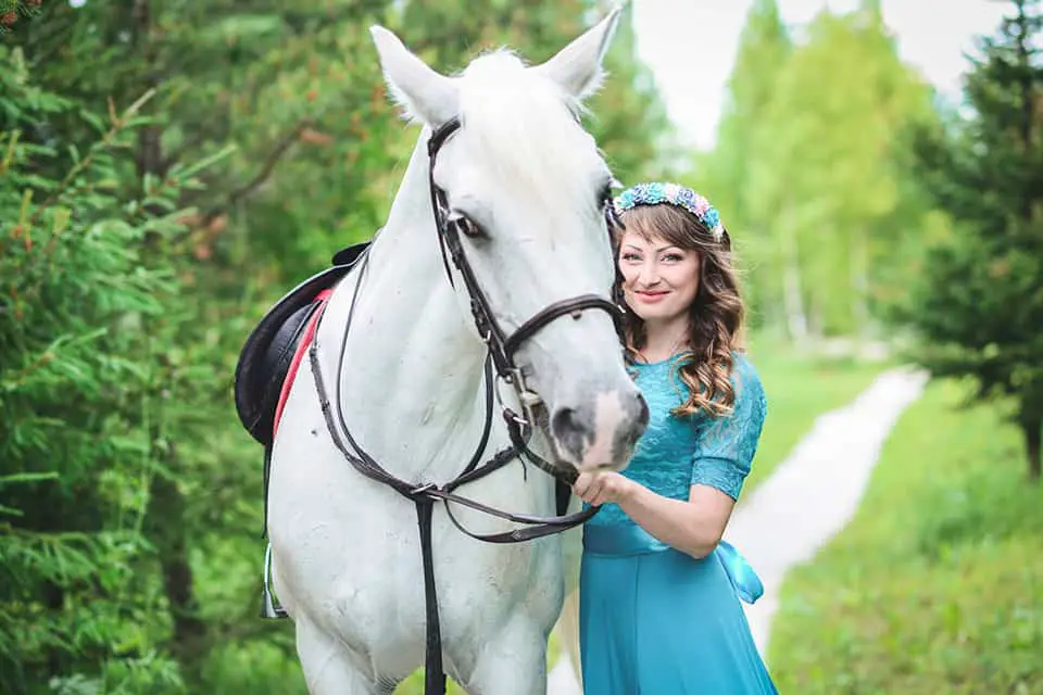 woman with a white horse