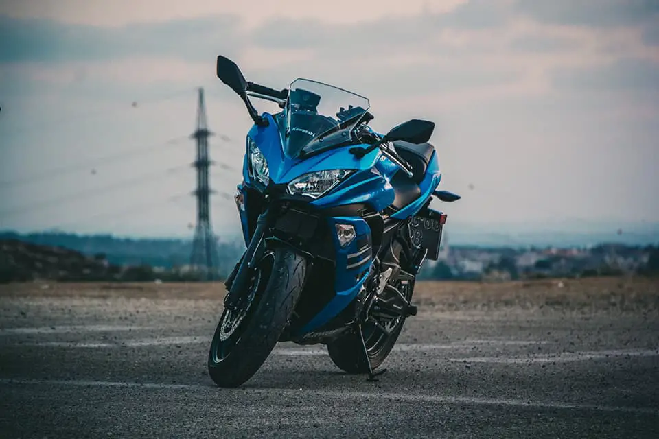 blue bike motorcycle in the street