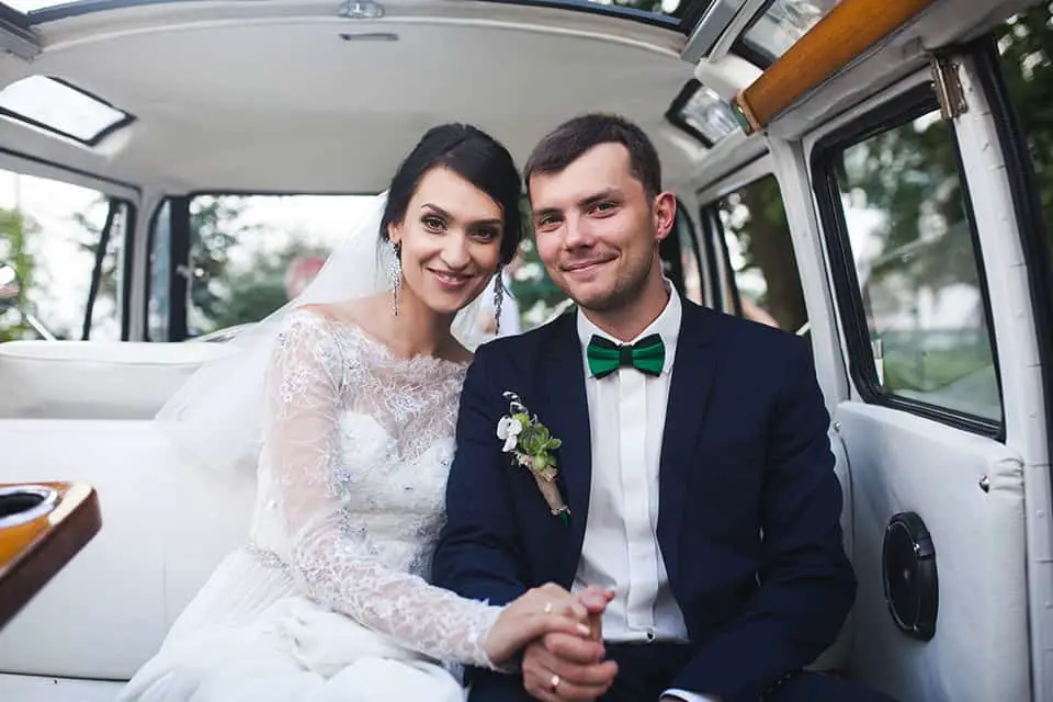 couple posing in a car