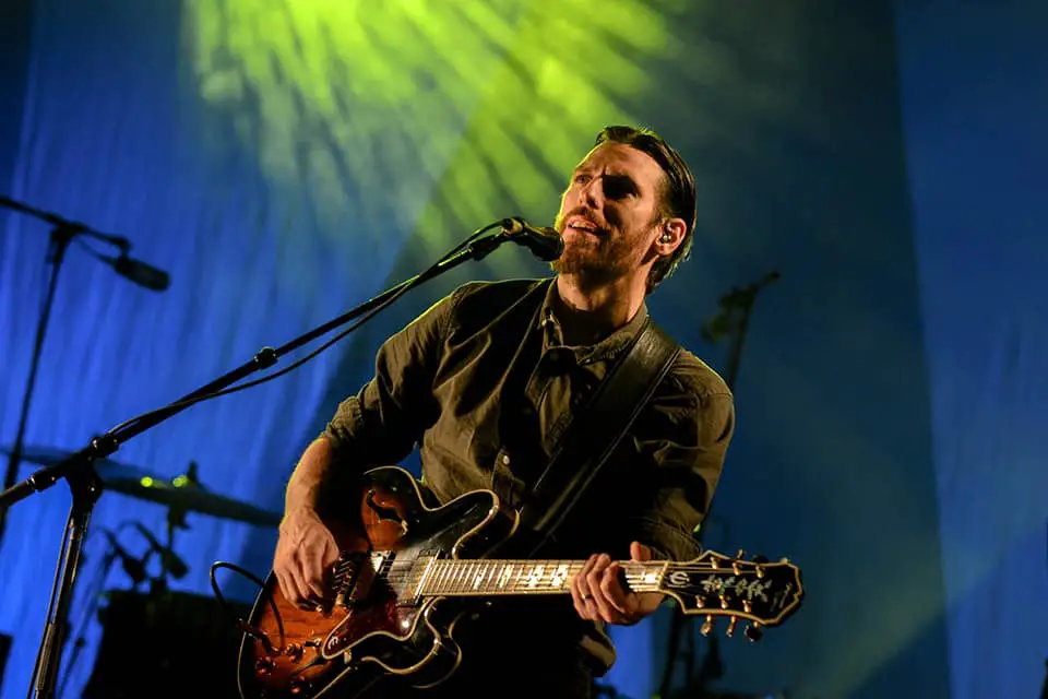 man playing electric guitar