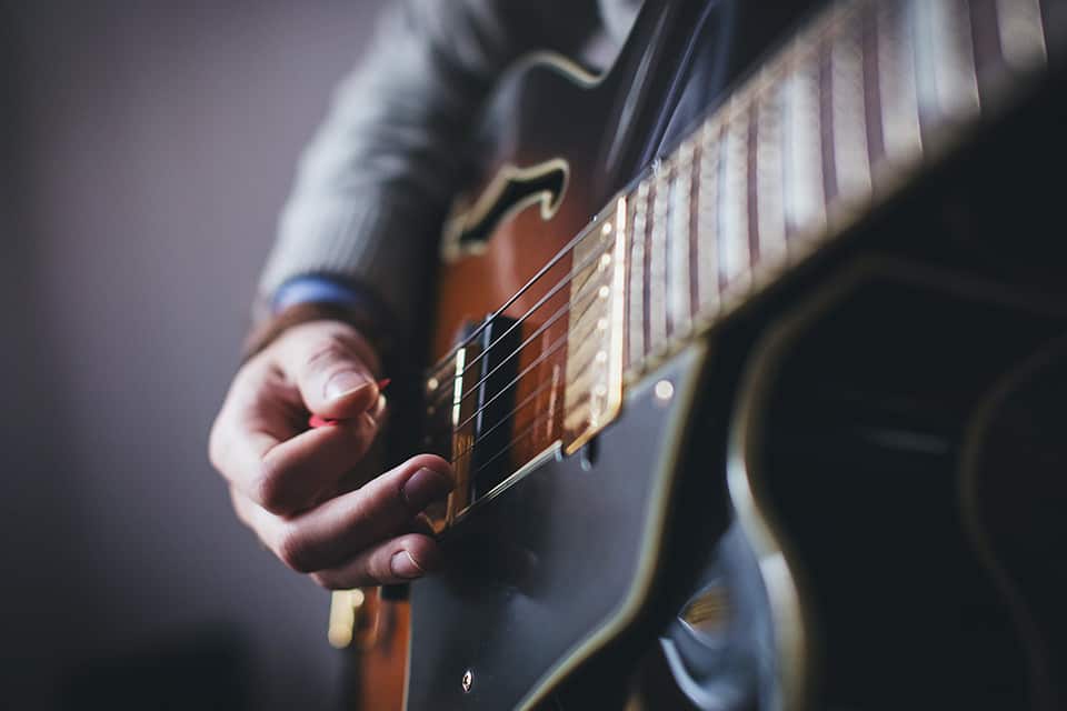 musician playing guitar