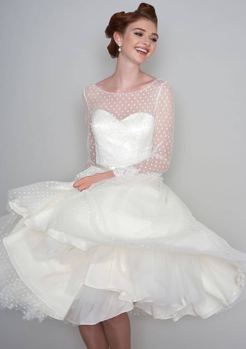 Woman smiling while wearing her polka dot dress