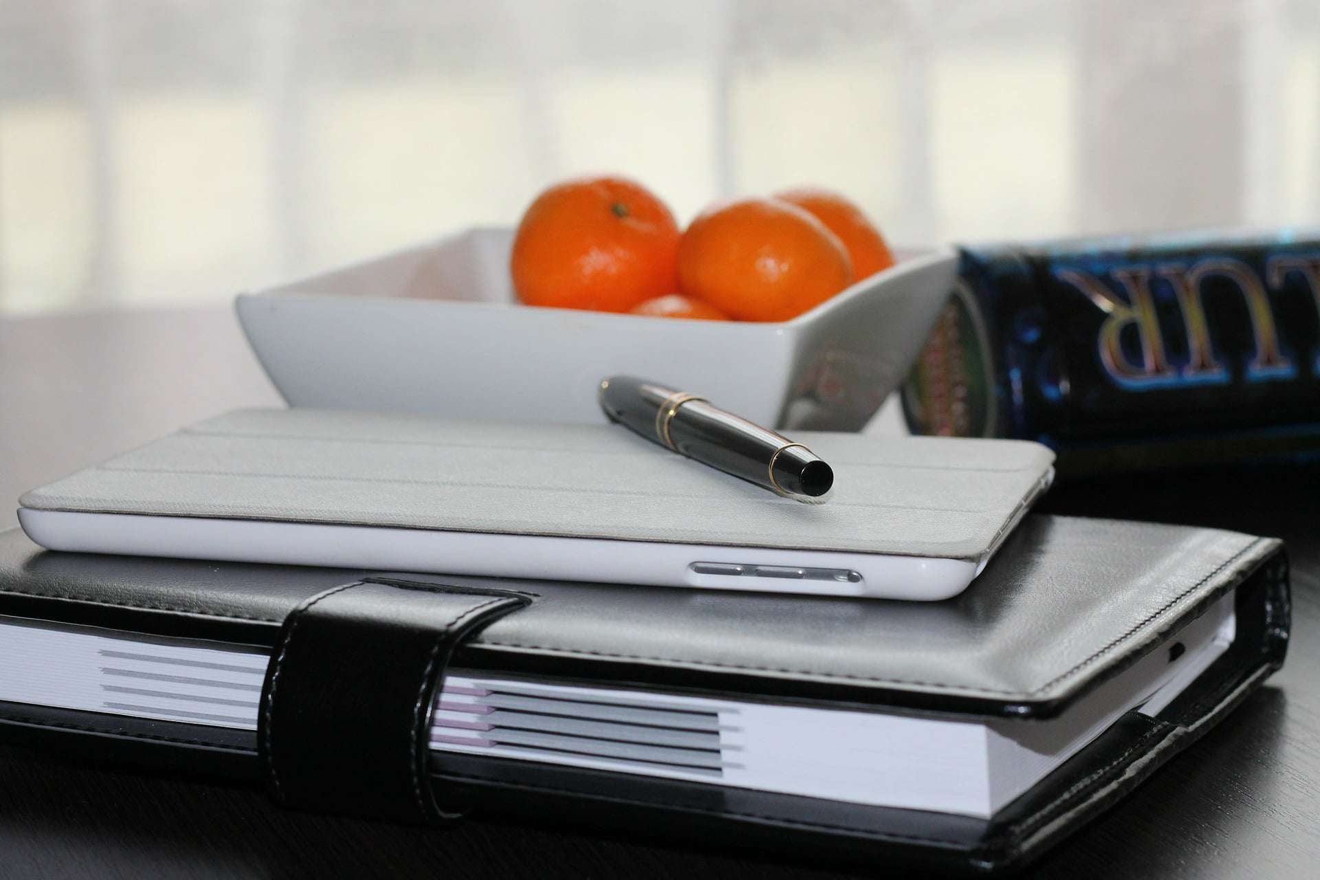 A tablet placed at the top of the best wedding planner book