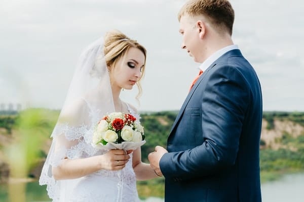 bride and groom facing each other